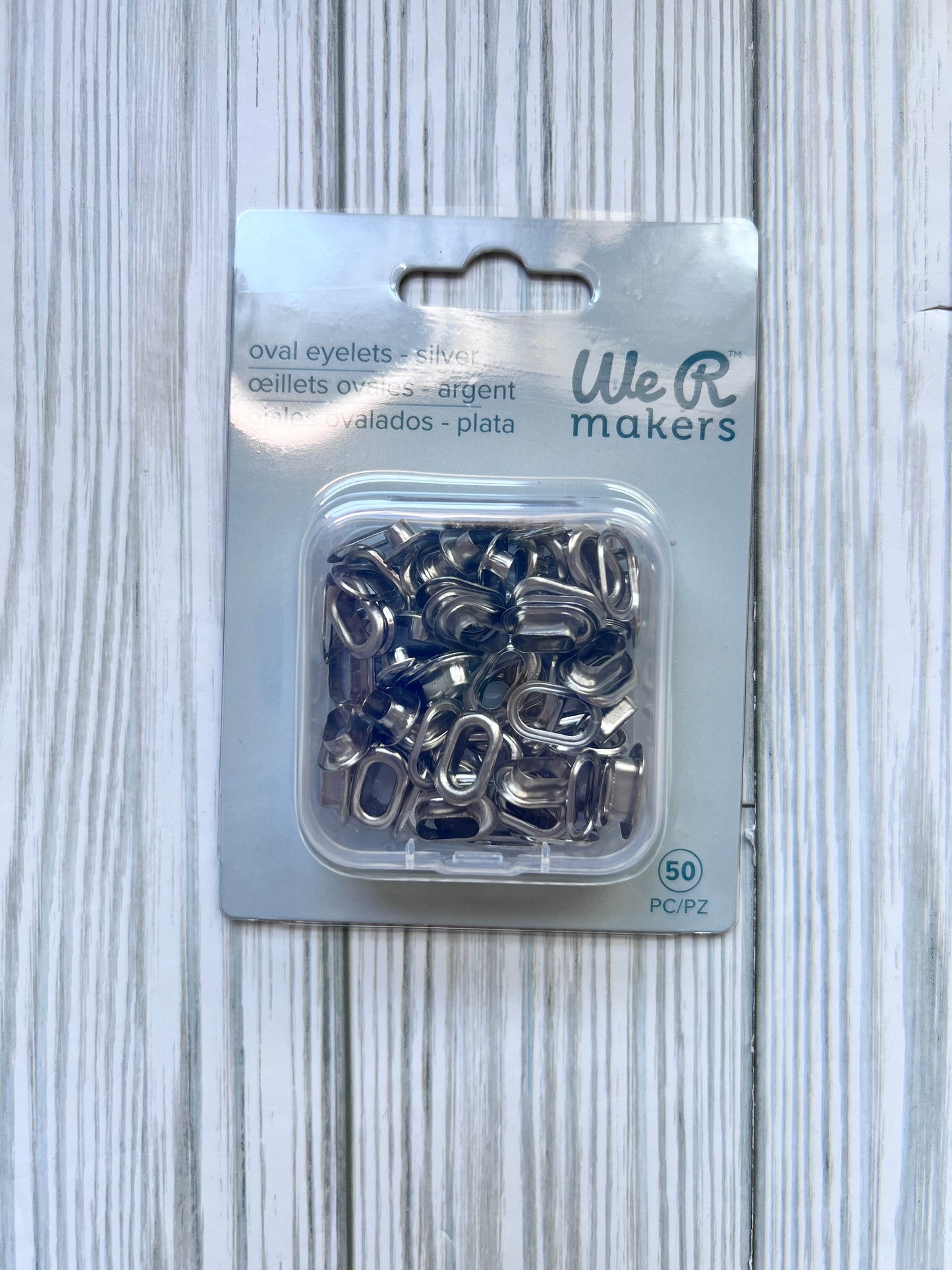 Oval Eyelets.  Silver Set of 50 Eyelets with Maching Washers. We R Makers.