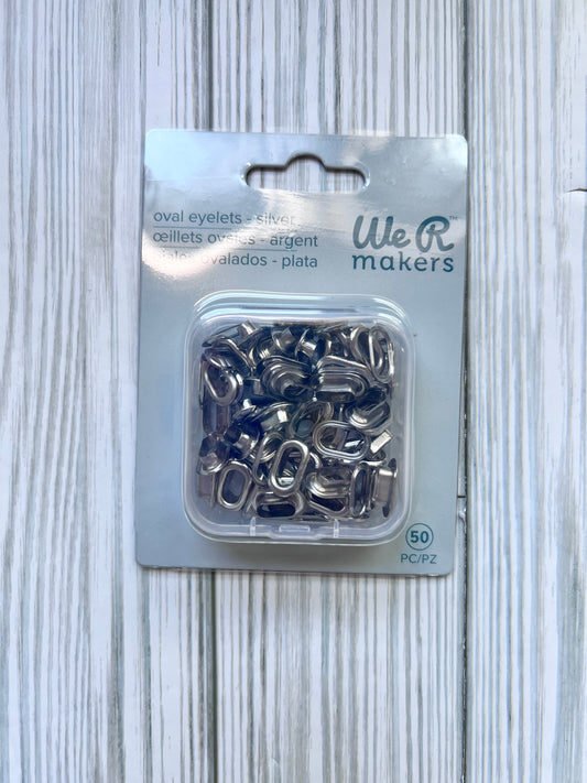 Oval Eyelets.  Silver Set of 50 Eyelets with Maching Washers. We R Makers.